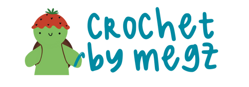 Logo of 'Crochet by Megz' with a green turtle wearing a strawberry hat.